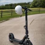 A scooter with a helmet on the back of it